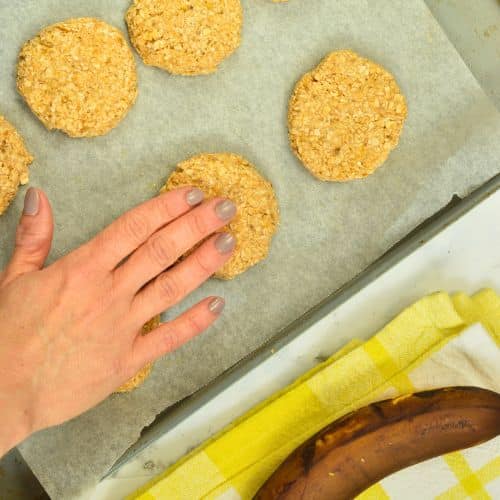 Forming Peanut Butter Banana Oatmeal Cookies on a baking sheet