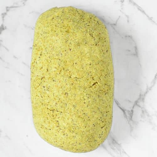 Vegan keto bread shaped into a loaf. 