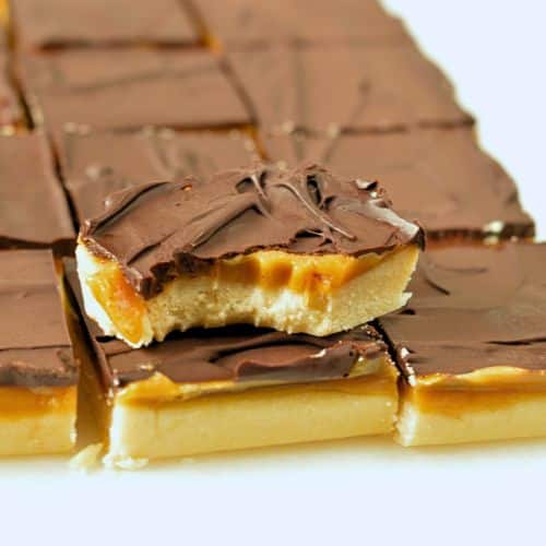 Vegan Millionaire Shortbread cut into squares.