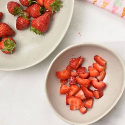Chopped strawberries in a mixing bowl.