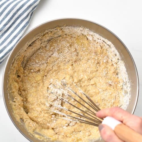 Combining the batter for the Oat Flour Banana Muffins