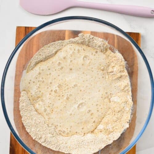 a mixing bowl with oat flour bread mixture