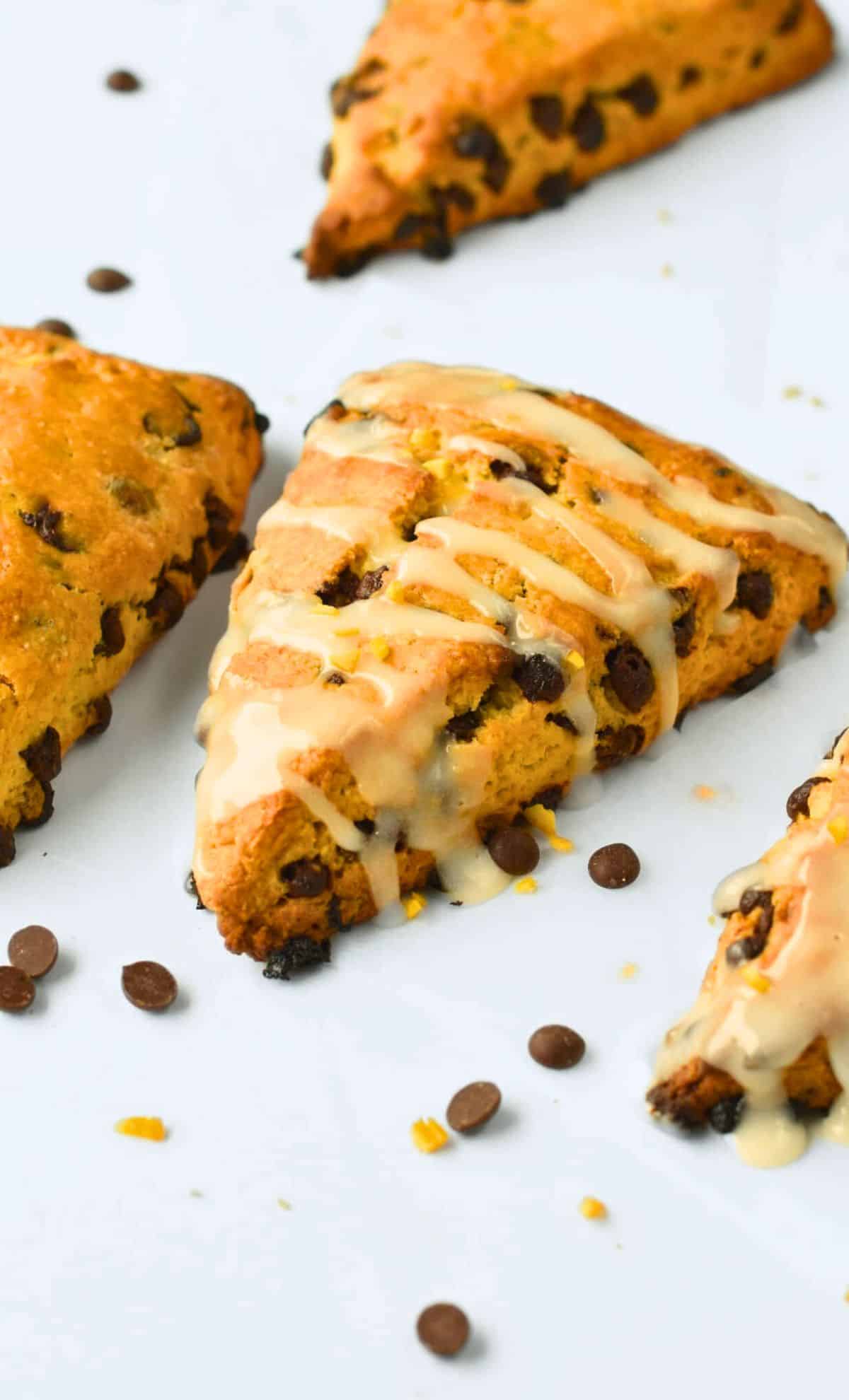 Vegan Chocolate Chip Scones decorated with melted vegan white chocolate.