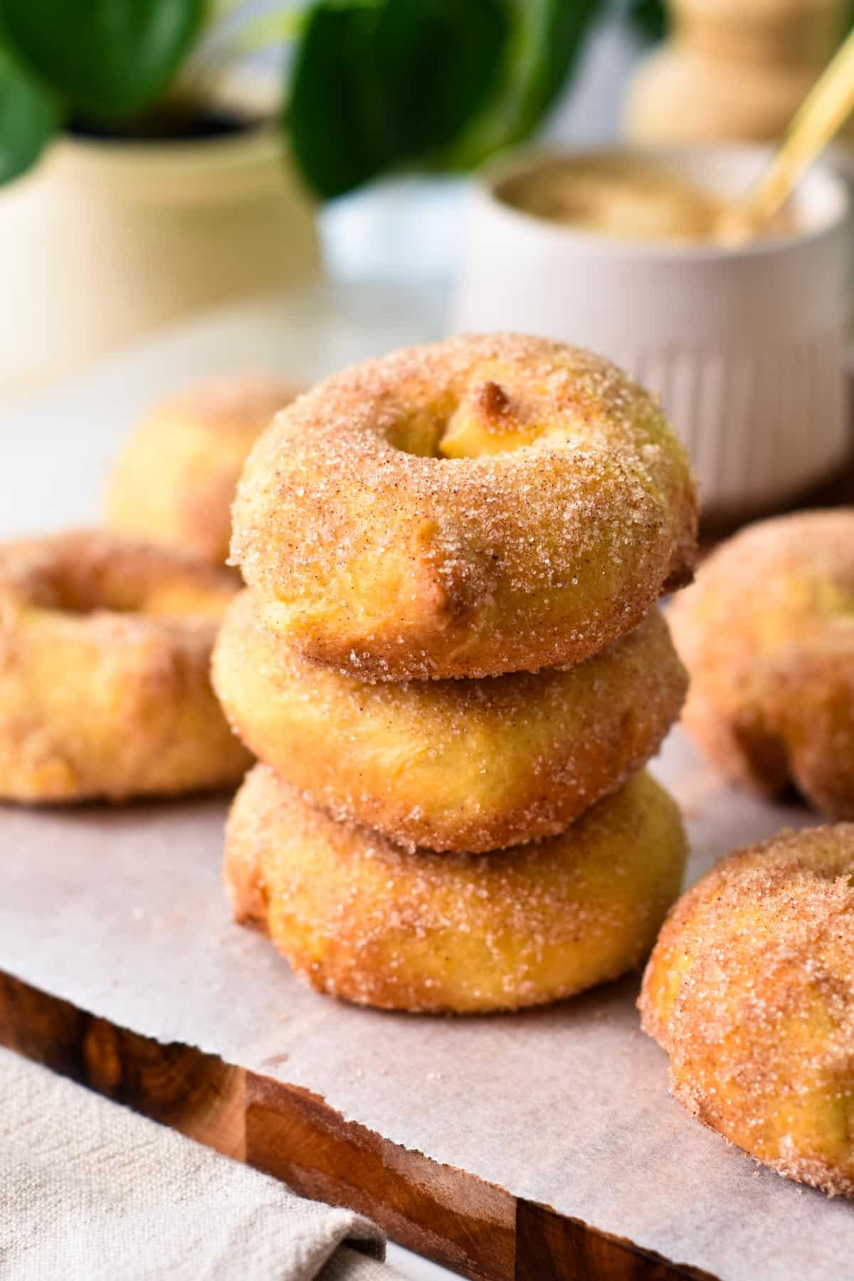 A stack of 3 sugar coated donuts baked in the air fryer.