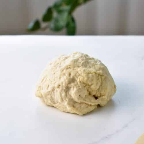 A ball of dough to make air fryer donuts.