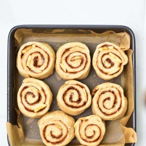 a baking dish filled with 9 banana cinnamon rolls