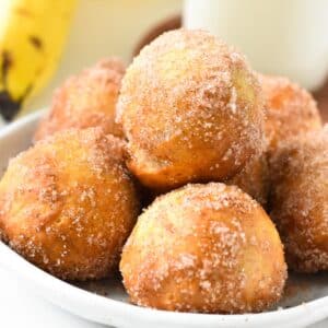 a stack of banana donut holes in a bowl