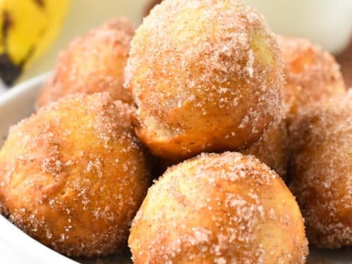a stack of banana donut holes in a bowl