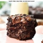 a stack of two pieces of healthy brownies cut in the front to show the ultra fudgy texture