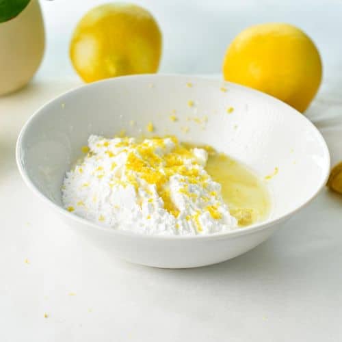 Mixing bowl with lemon glazing ingredients.