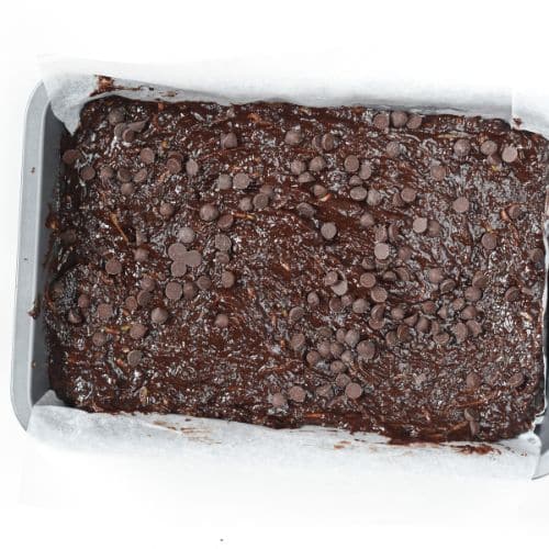 Vegan Zucchini Brownies in a baking pan ready to be baked.