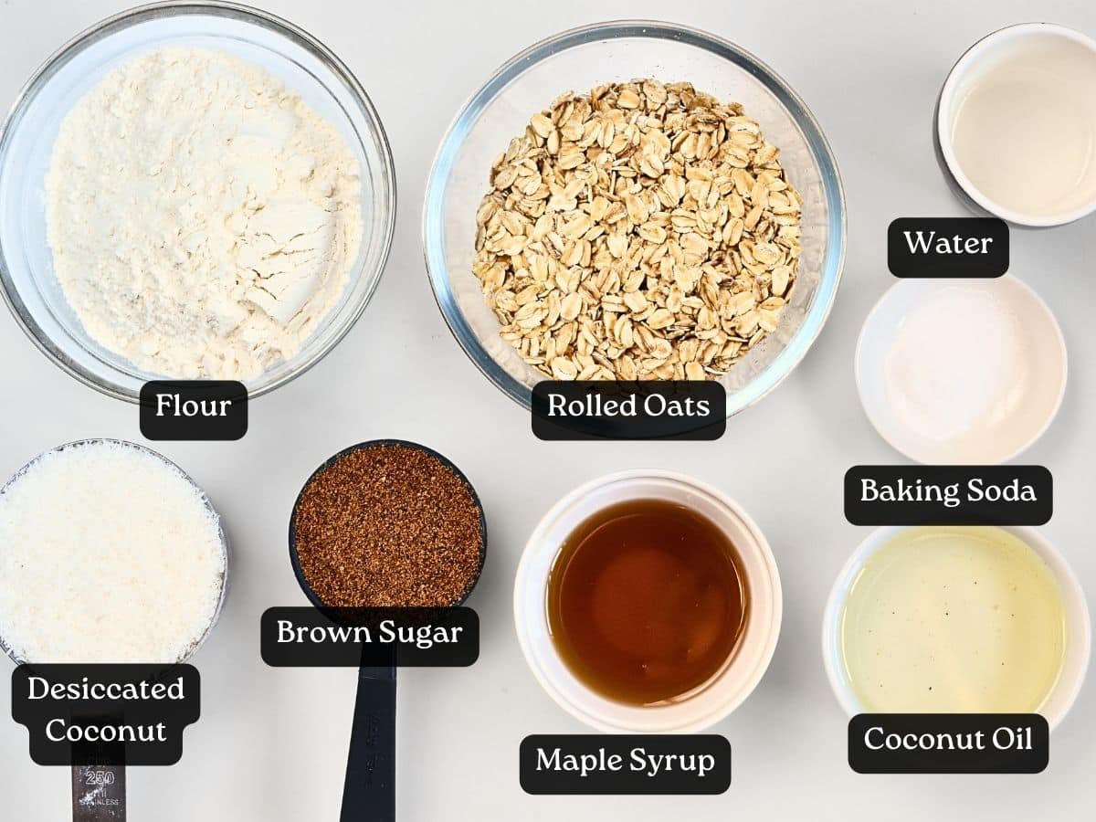Anzac biscuit ingredients in bowls and ramekins.