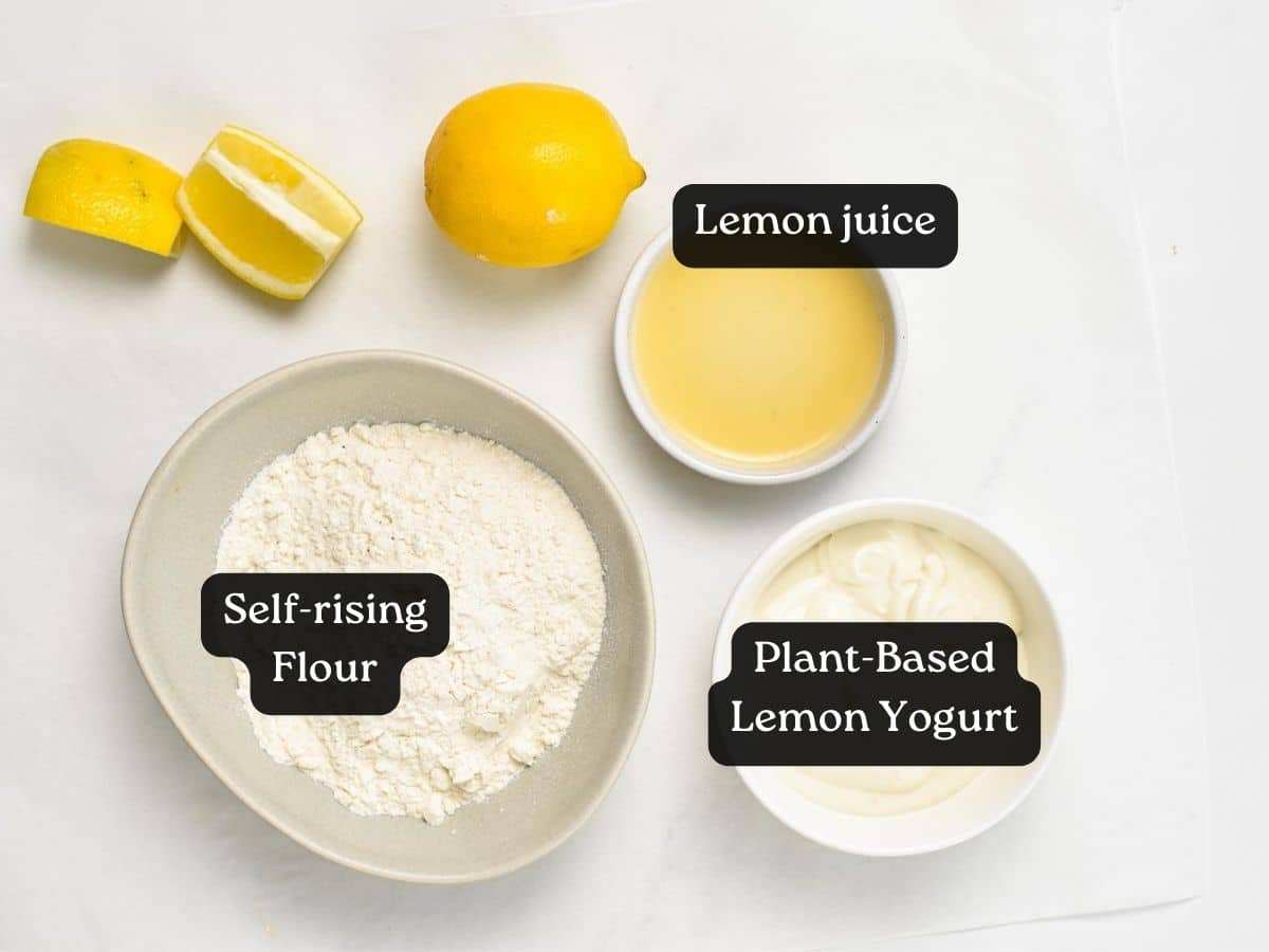 A picture of the 3 ingredients to make lemon donuts. A bowl with self-rising flour, one with lemon juice and one with lemon yogurt.