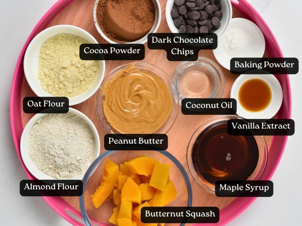 Ingredients for Butternut Squash Brownies in bowls and ramekins on a serving tray.