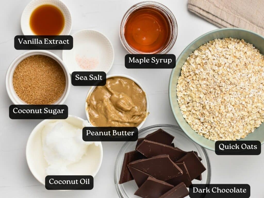 Ingredients for Chocolate Peanut Butter Oatmeal Bars in bowls and ramekins.