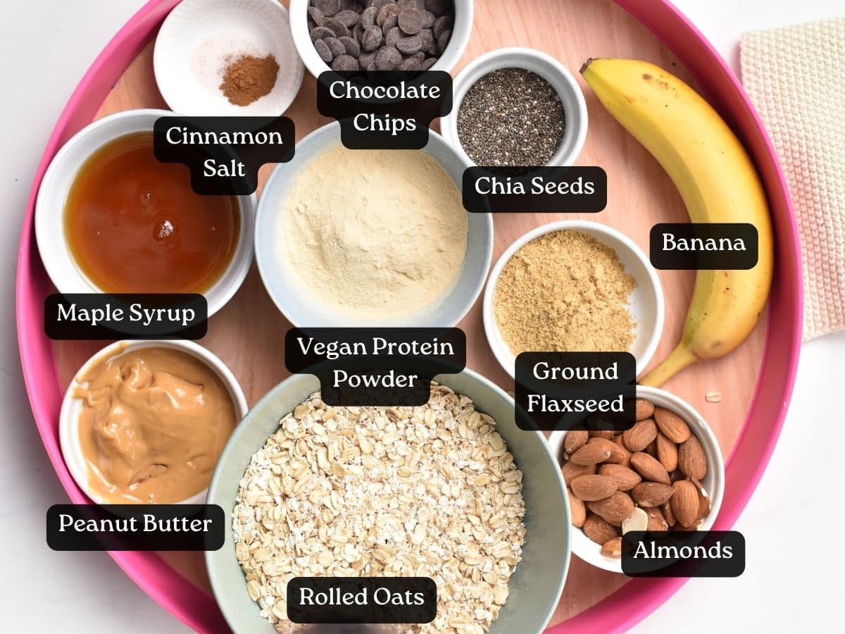 Ingredients for Banana Protein Balls in bowls and ramekins on a serving tray