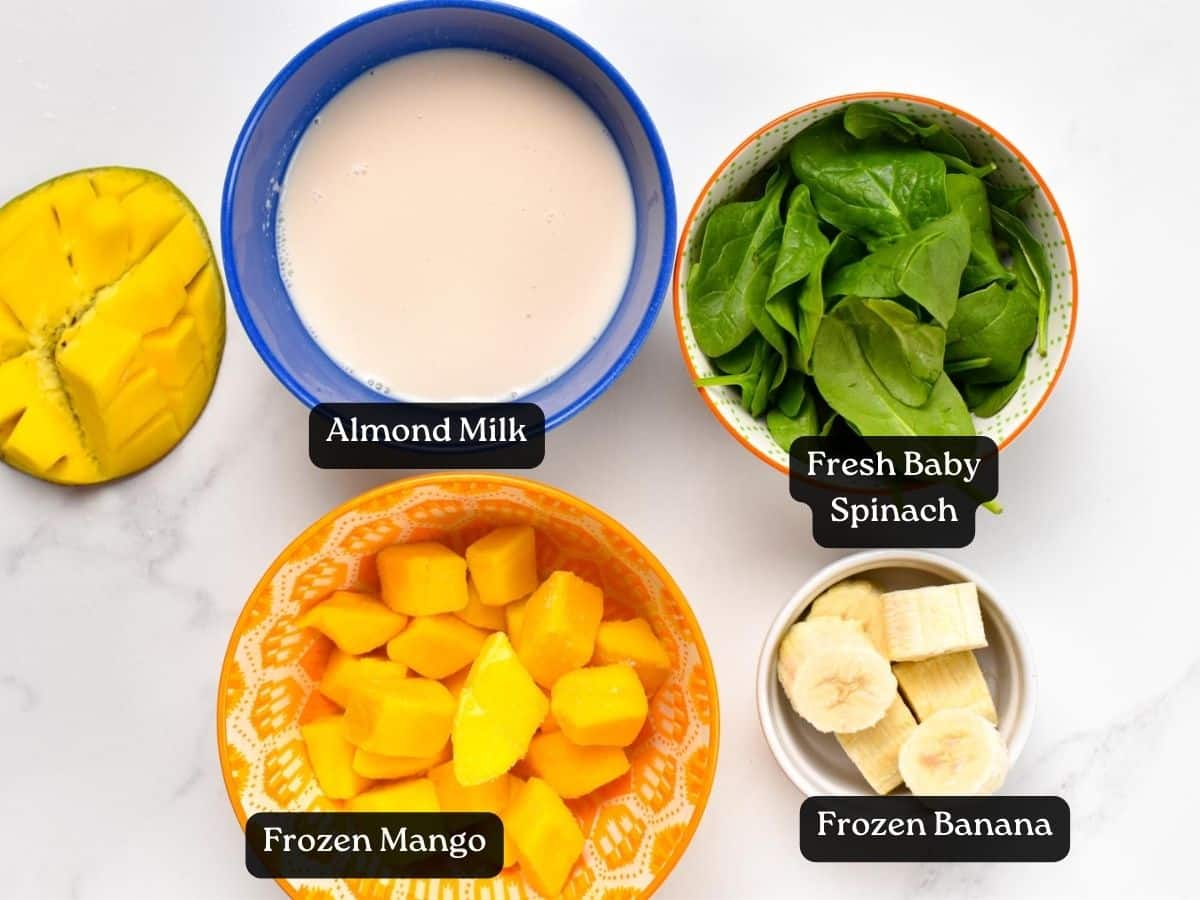 Ingredients for Mango Spinach Smoothie in bowls and ramekins.