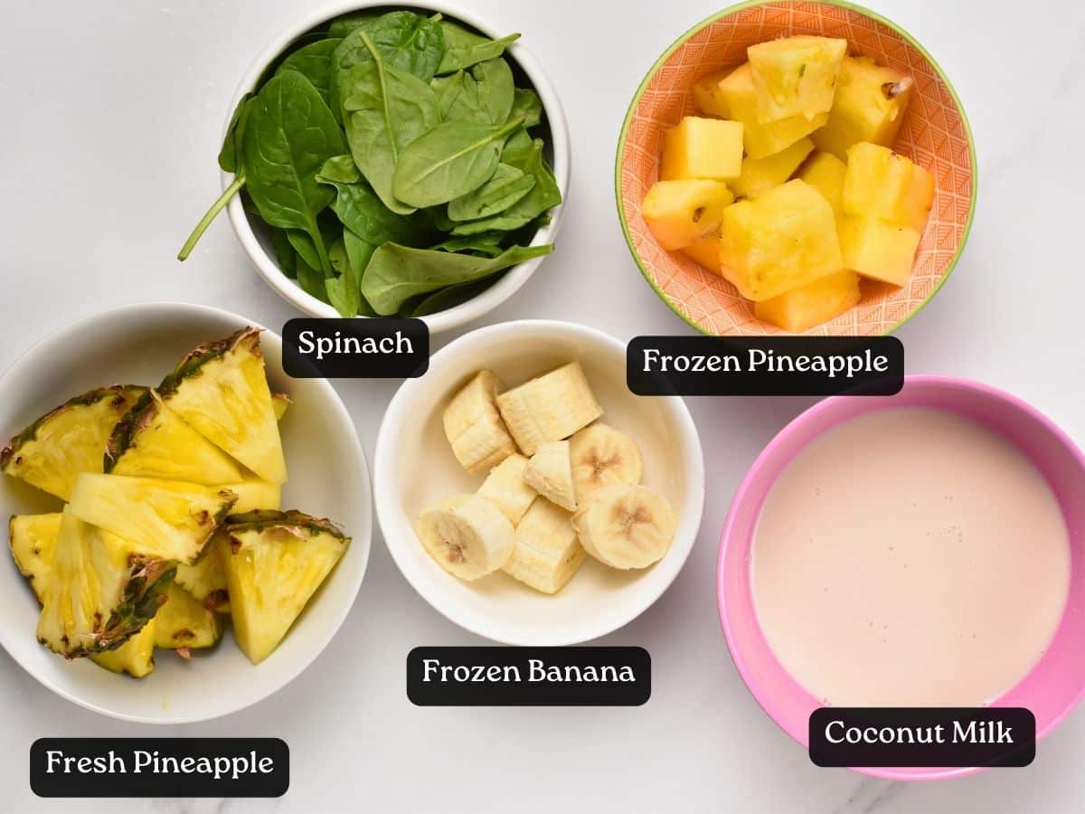 Ingredients for Spinach Pineapple Banana Smoothie in small bowls.