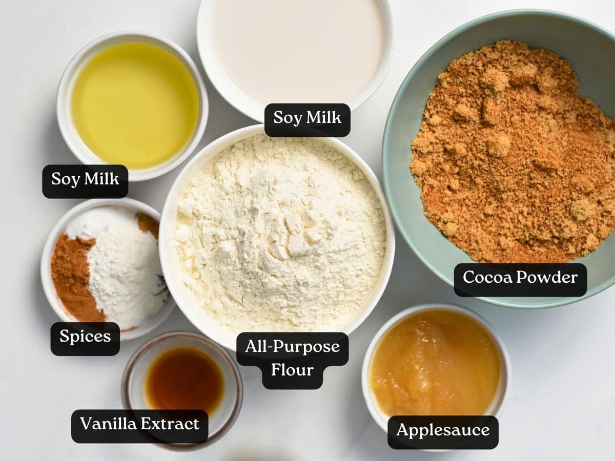 Ingredients for Vegan Carrot Cake in bowls and ramekins.