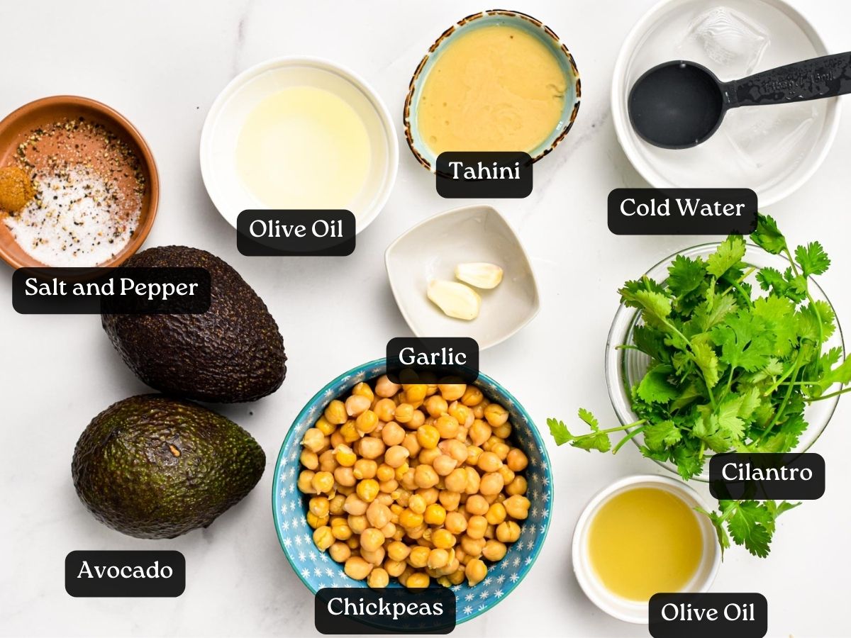 Ingredients for avocado hummus in bowls and ramekins.