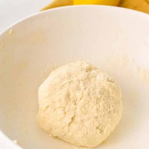 a dough ball in a mixing bowl