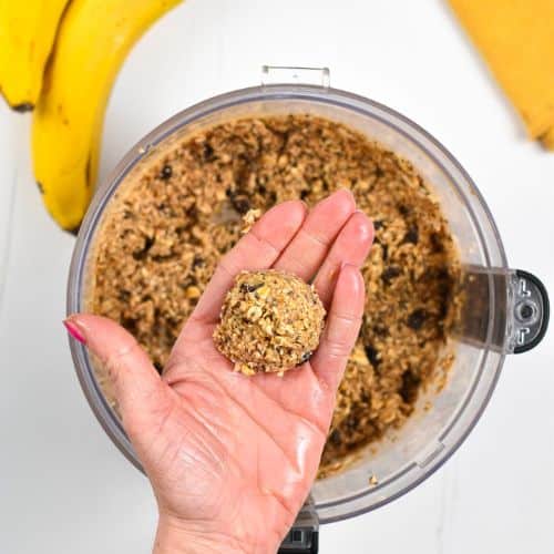 Rolling Banana Oat Balls above the batter in a food processor.