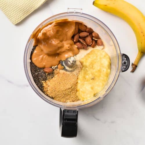 Banana Protein Balls ingredients in the bowl of a food processor