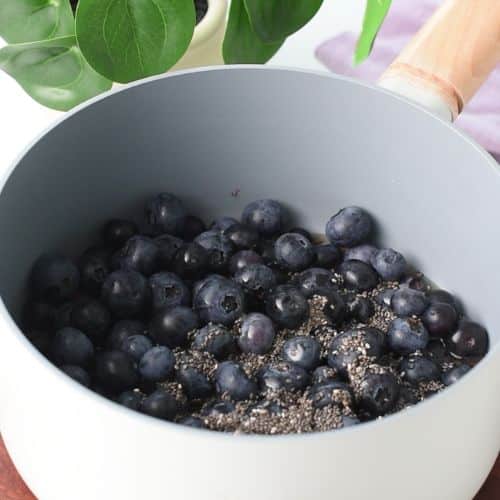 Chia blueberry jam in a saucepan.