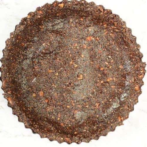 Chocolate Avocado Pie crust pressed in a large pan.