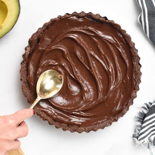 Spreading the avocado chocolate mousse in the pan.