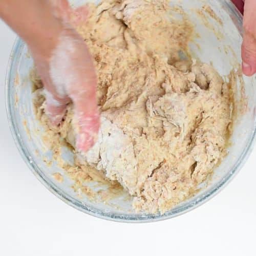 Combining the Vegan Irish Soda Bread dough with the hands.