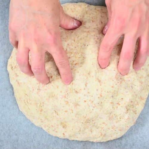Forming Vegan Irish Soda Bread on a baking sheet.