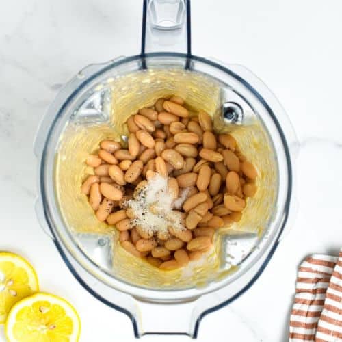 Vegan White Bean Dip ingredients in the jug of a blender.