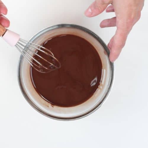 Melting chocolate in a mixing bowl.