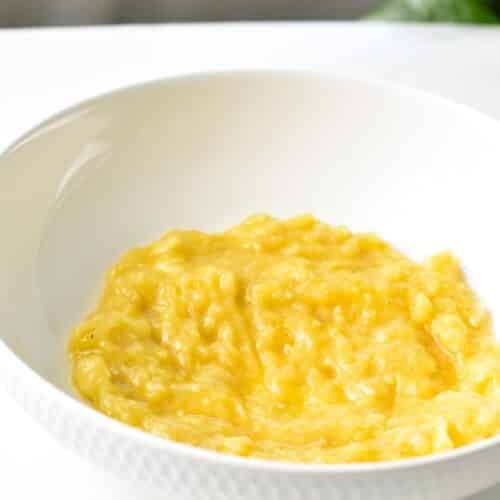 mashed banana in a mixing bowl