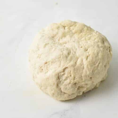 A ball of dough to make air fryer donut holes.