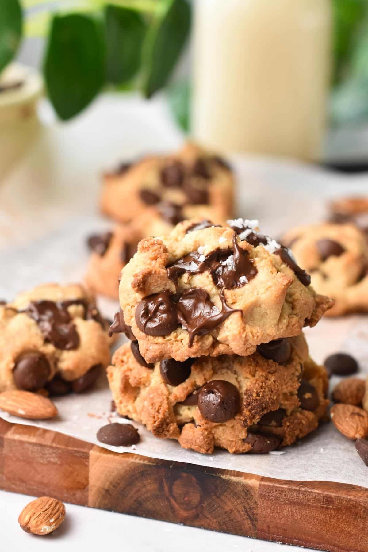 a stack of two almond flour chocolate chip cookies and a pinch of salt.