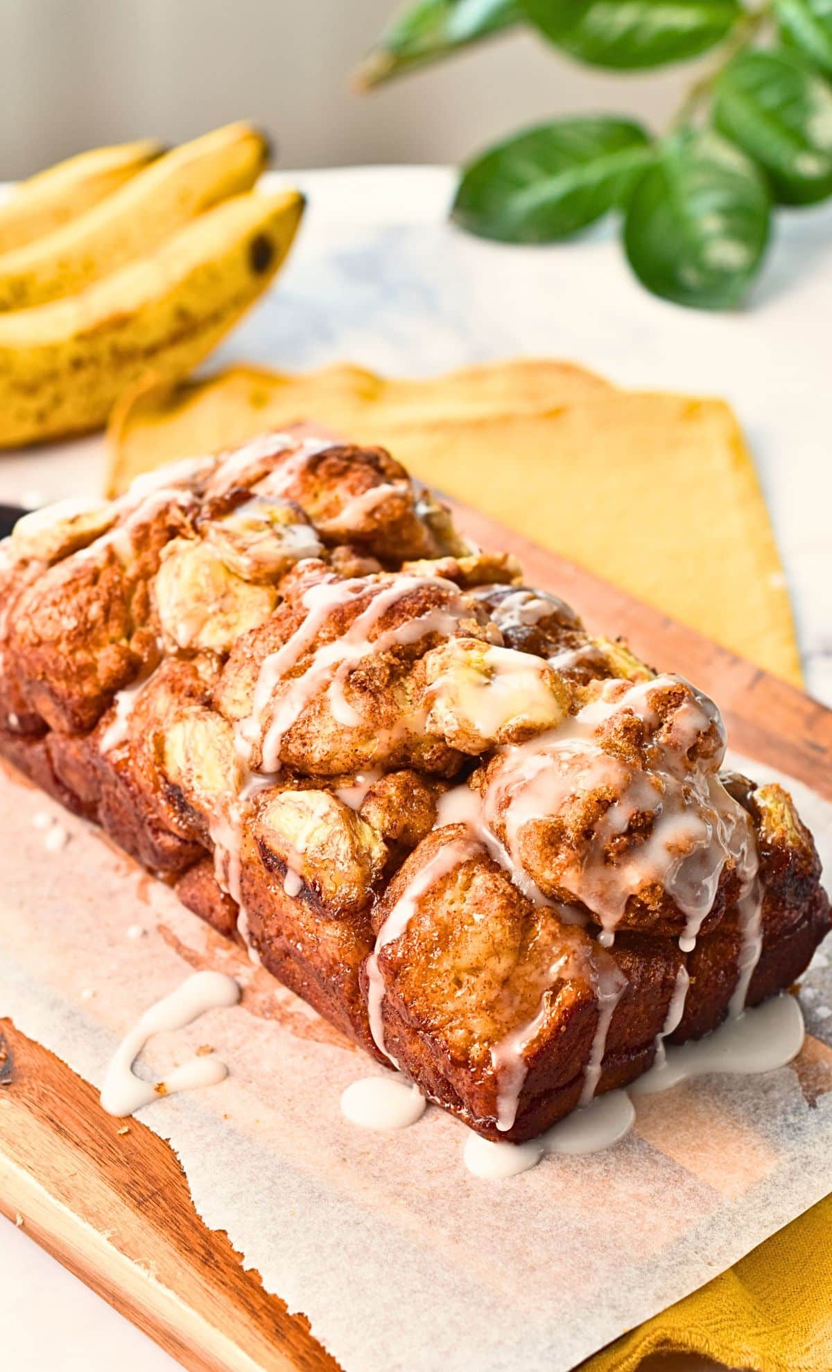 Loaf of banana monkey bread on a chopping board.