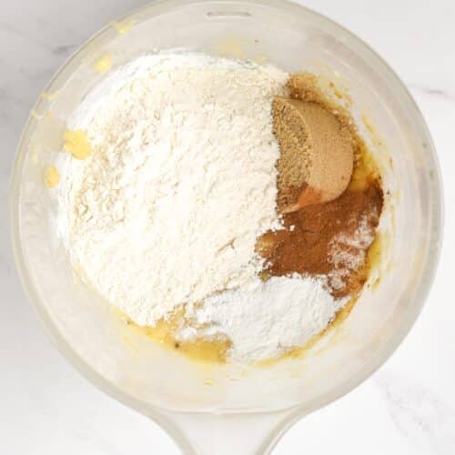 Dry eggless banana bread ingredients in a mixing bowl.