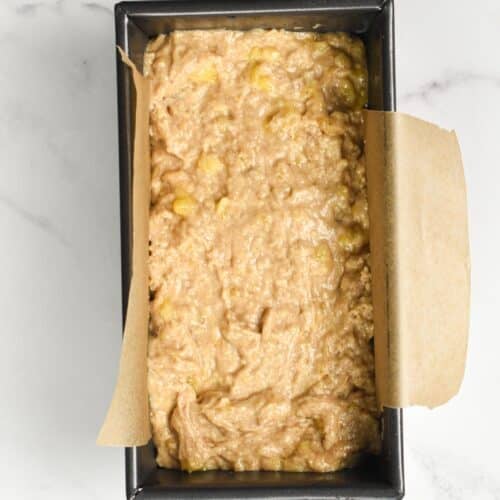 Eggless banana bread batter in a loaf pan.