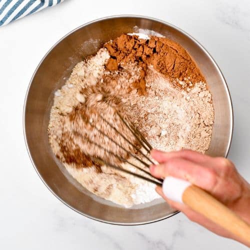 Stirring the dry protein cake ingredients.