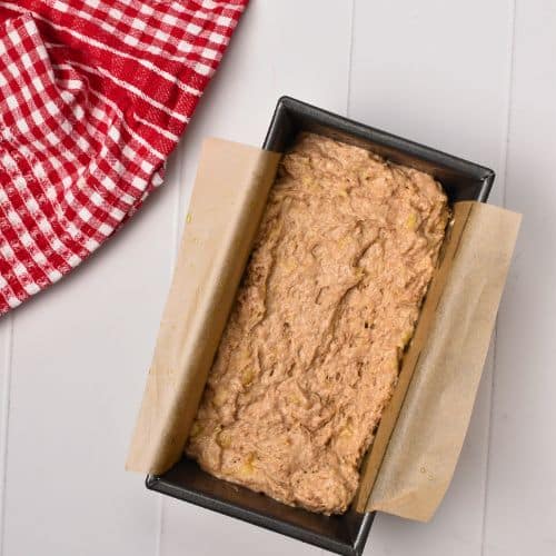 No-Sugar-Added Banana Bread batter in a loaf pan.