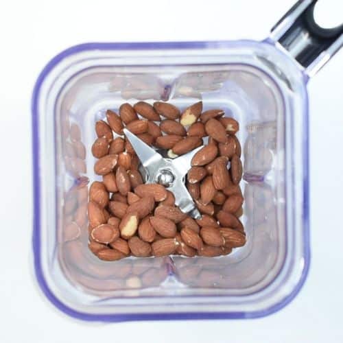 Almonds in the jug of a blender.
