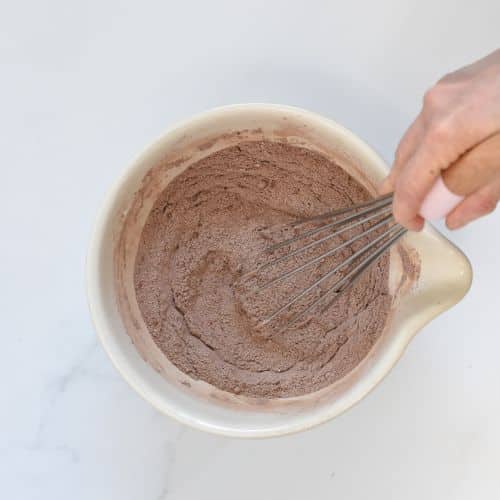 Stirred dry vegan chocolate cupcake ingredients.