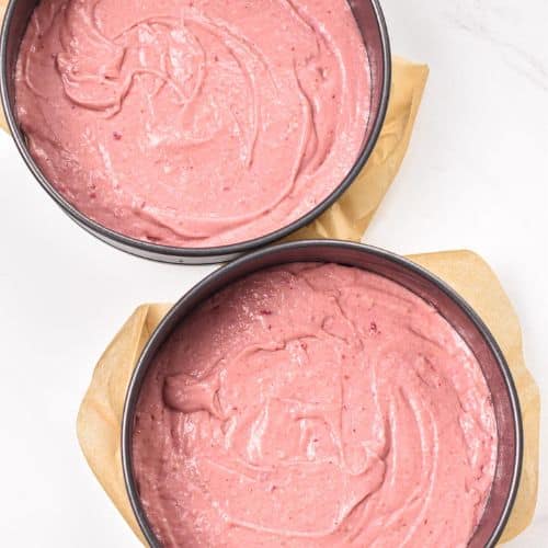 Vegan strawberry cake batter in two springform pans.