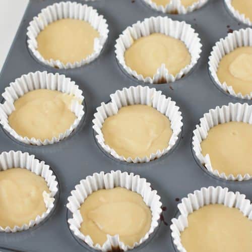 Vegan cupcakes ready to bake in a muffin tin.