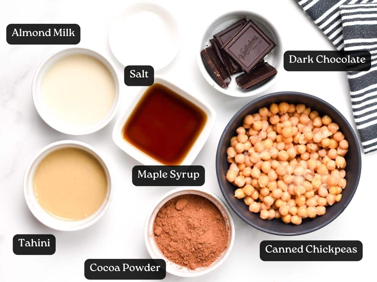 Ingredients for Dark Chocolate Hummus in bowls and ramekins.