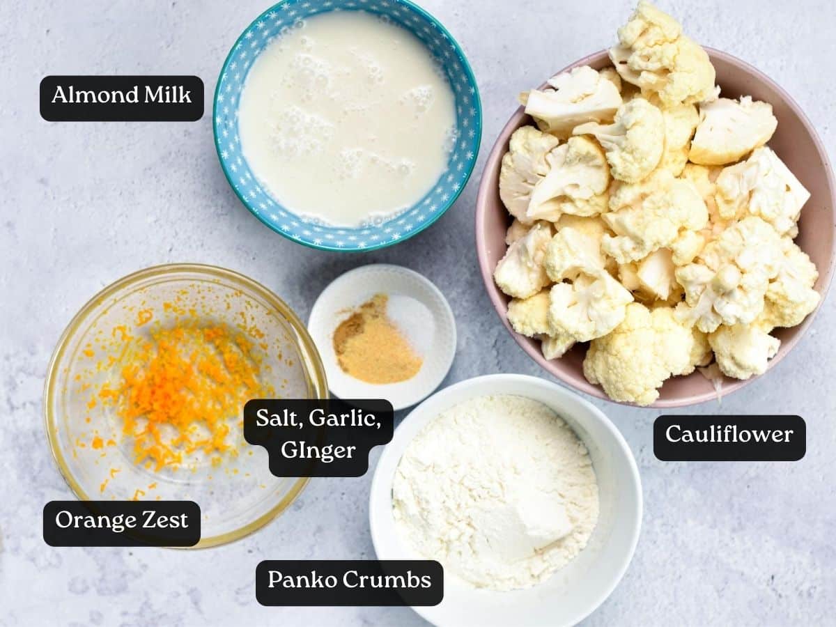 Ingredients for Orange Cauliflower in bowls and ramekins.