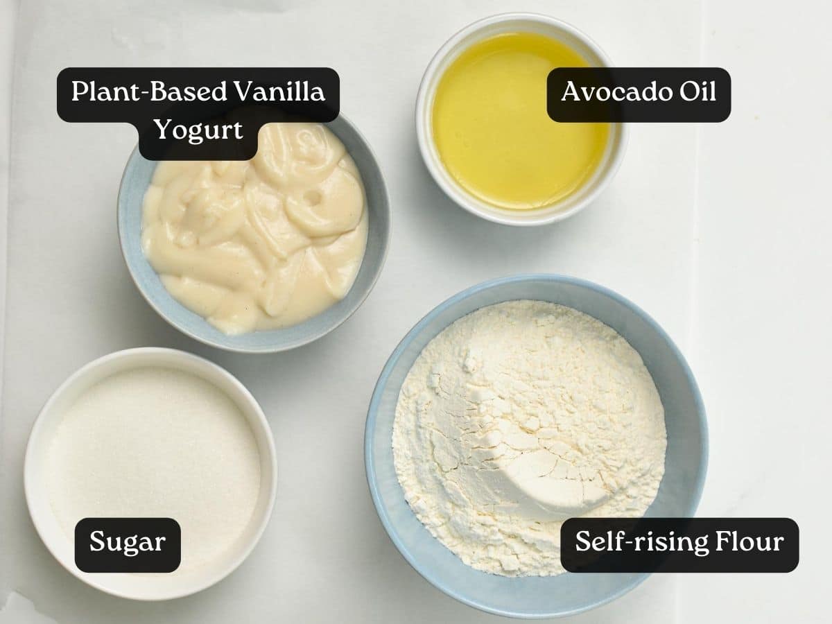 bowls filled with avocado oil, self-rising flour, sugar, and plant-based yogurt