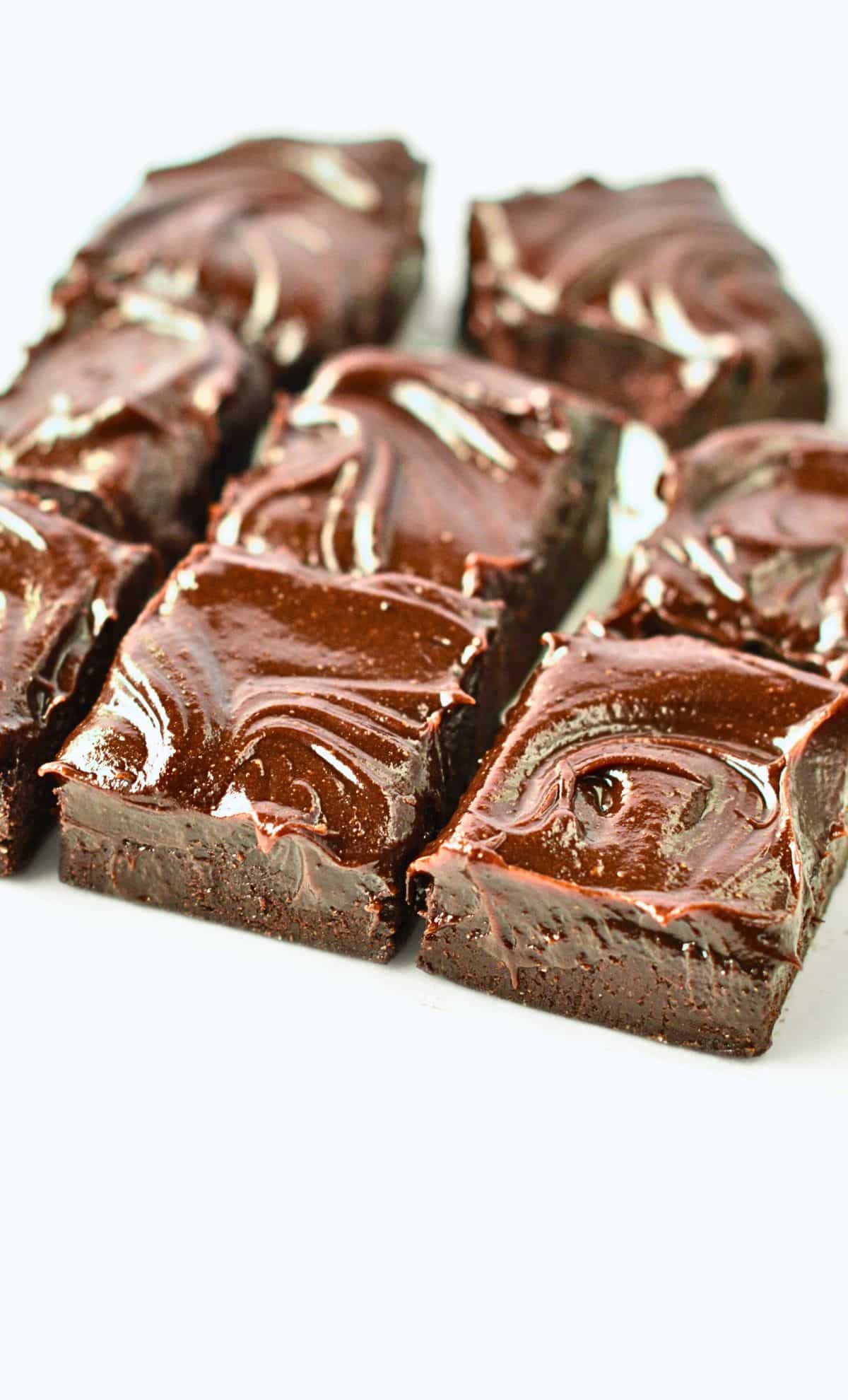 No-Bake Brownies sliced on a white table.